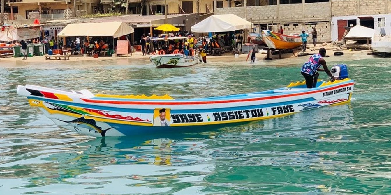 TourVessels fleet on the beach — ready for tours, fishing, and work TourVessels fleet of unsinkable fiberglass commercial open boats resting on the beach — available 10m to 25m. Built for the Deep Blue.
